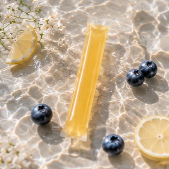 Daily jelly stick in clear water with lemon slice and blueberries